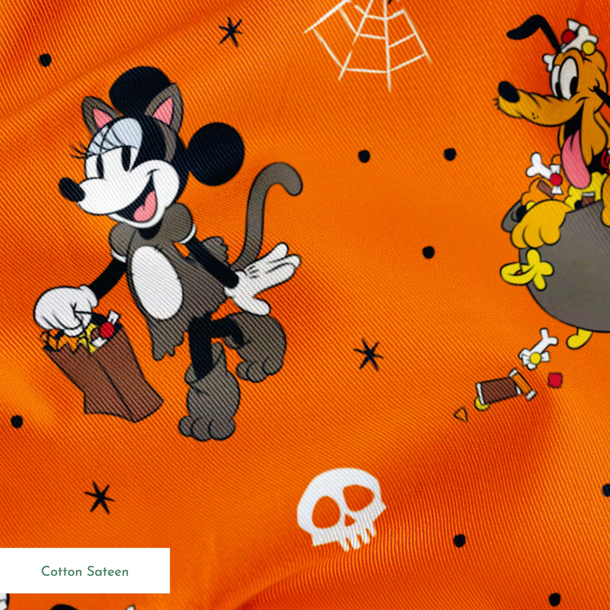 Halloween-themed orange pattern with Disney characters in costumes, spiderwebs, and skulls springs sateen texture