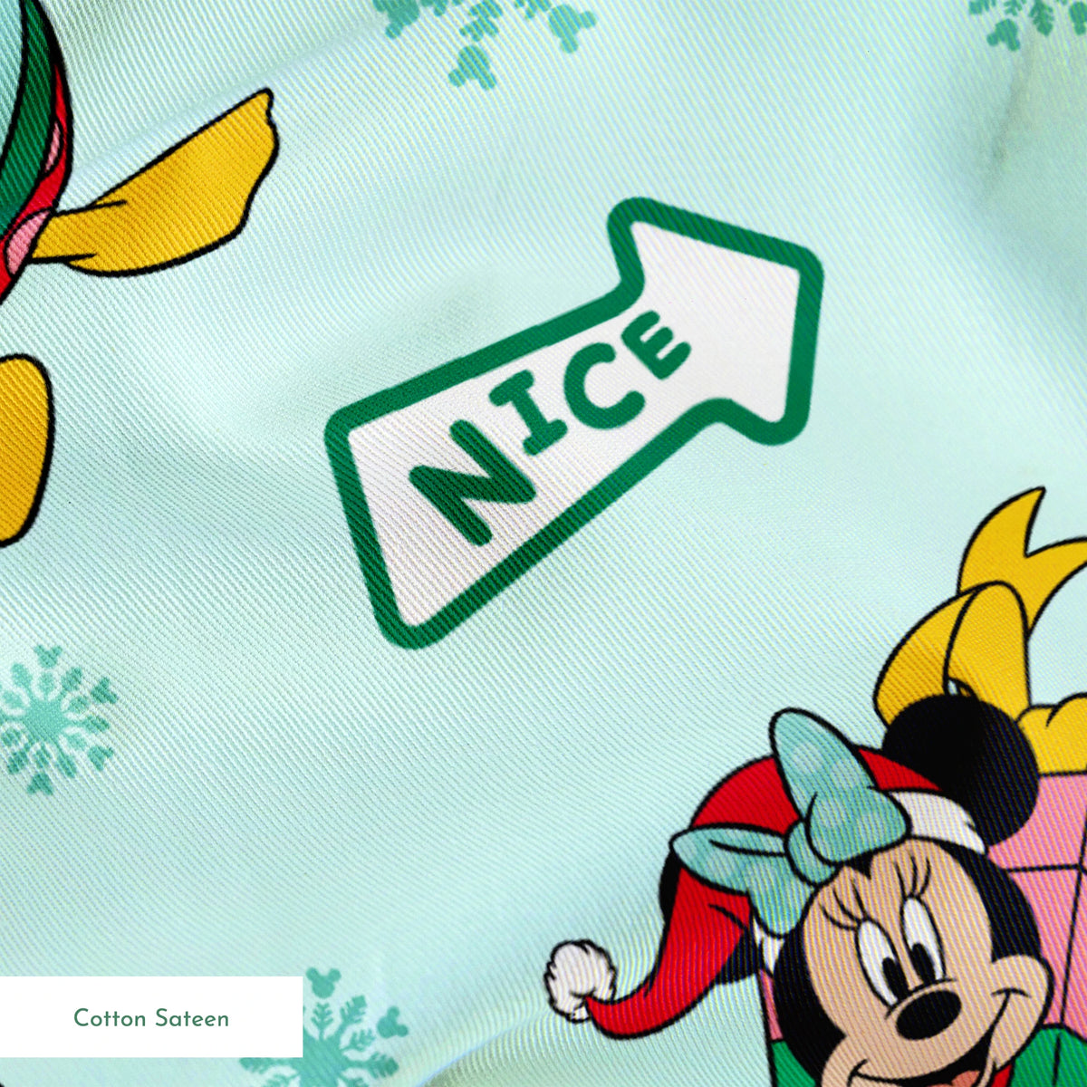 Disney character pattern with Minnie and Mickey in festive holiday outfits on light blue background with snowflakes and "Nice" signs. springs sateen texture