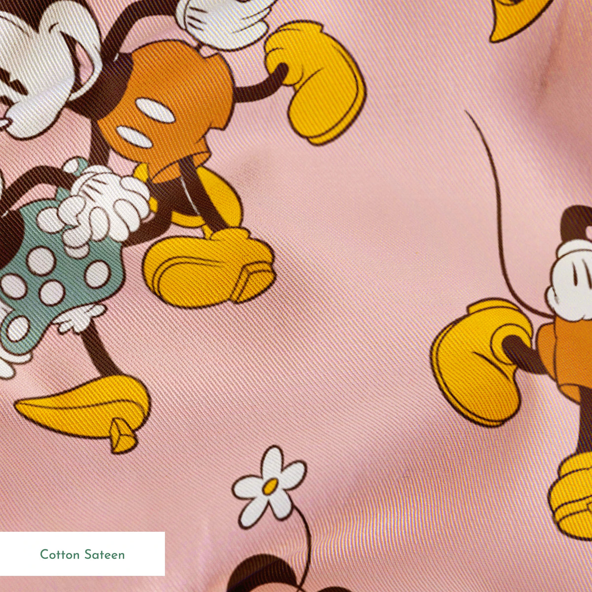 Mickey and Minnie Mouse characters in vintage style on pink background with repeated pattern springs sateen texture