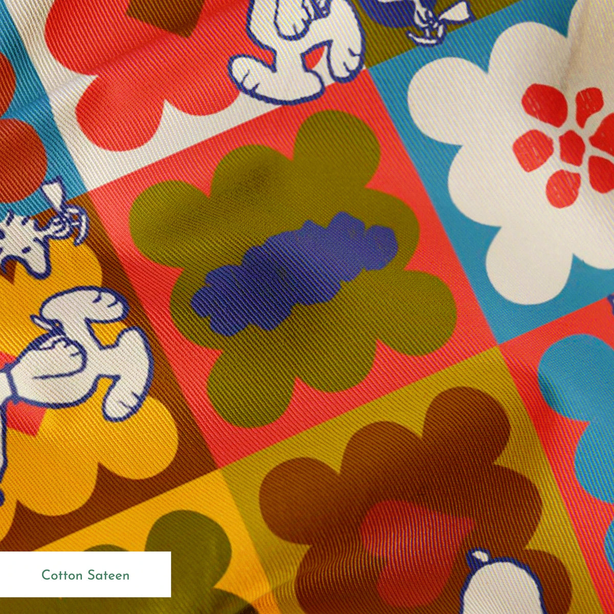 Colorful patchwork pattern featuring Snoopy characters in various squares with flowers, geometric shapes, and decorative elements springs sateen texture