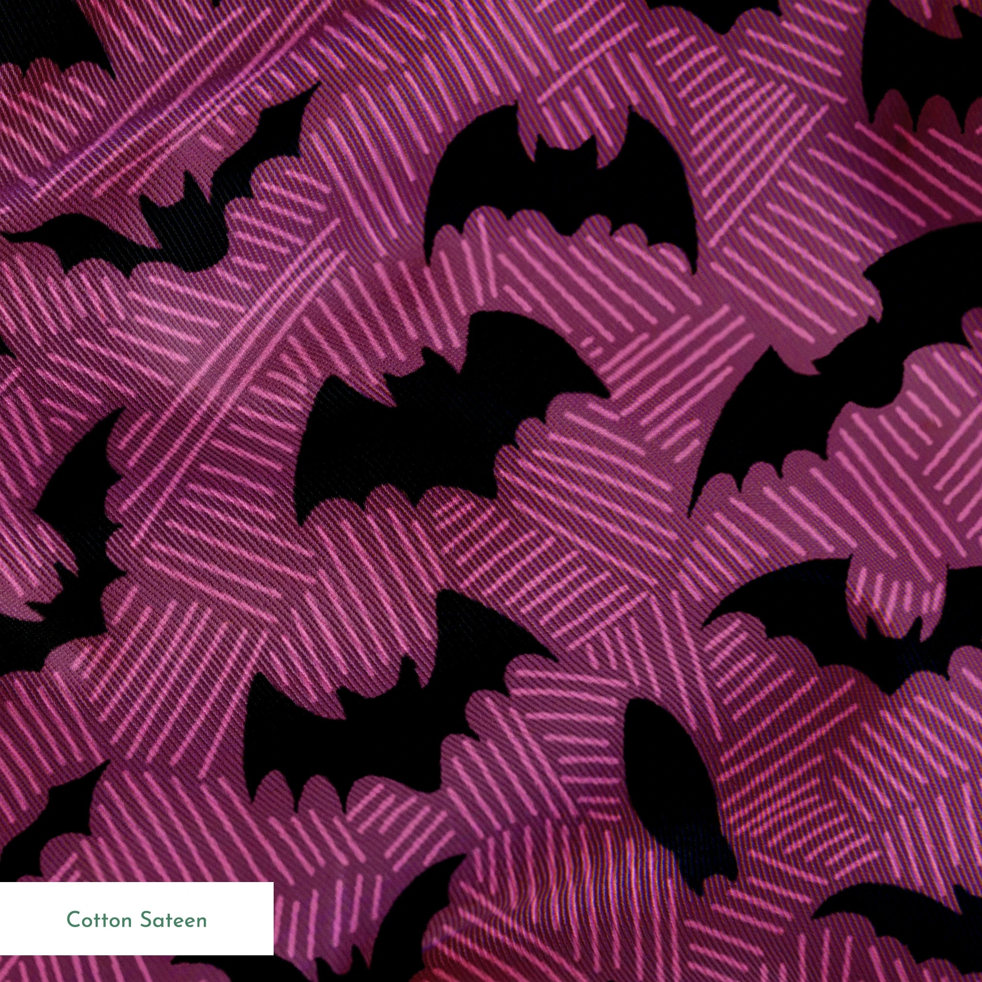Black bat silhouettes scattered across a purple background with swirling line pattern springs sateen texture