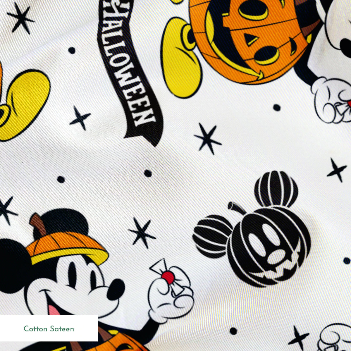 Mickey Mouse Halloween pattern dressed as pumpkins on white background with stars and "Happy Halloween" text springs sateen texture