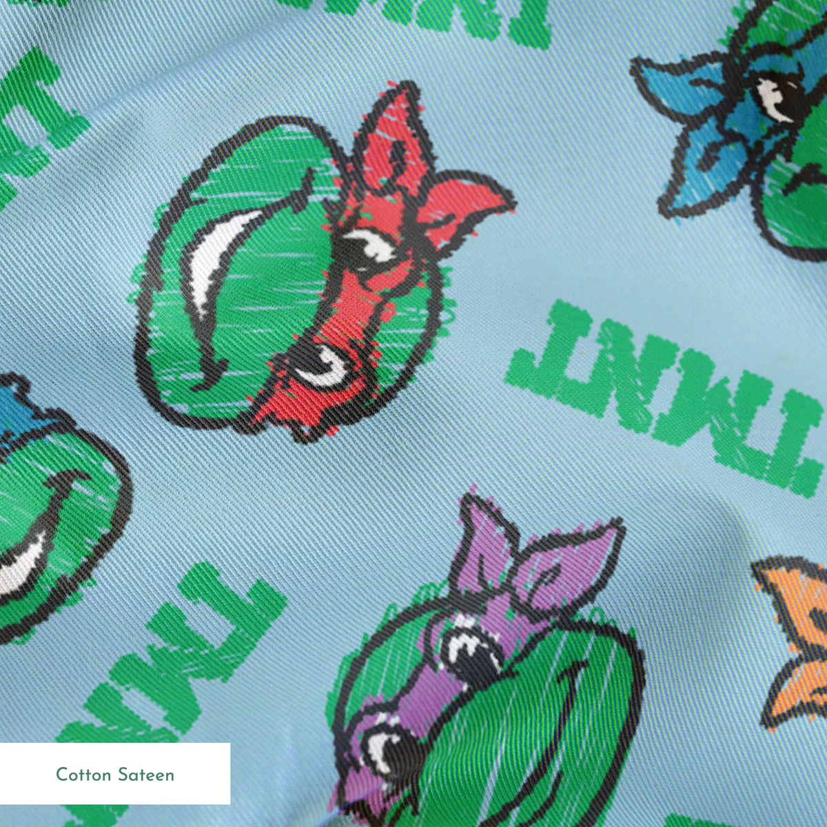 Cartoon pattern of Teenage Mutant Ninja Turtles faces with colored masks on light blue background springs sateen texture