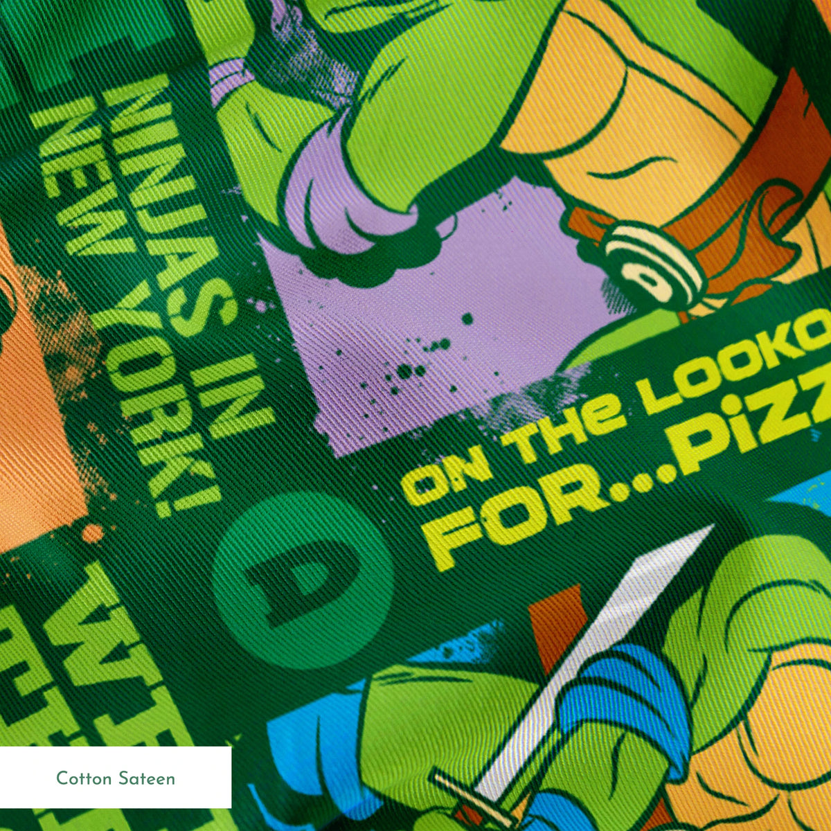 Teenage Mutant Ninja Turtles comic-style panels with phrases like "Catchin' a cab!" and "On the lookout for pizza!" on green background springs sateen texture