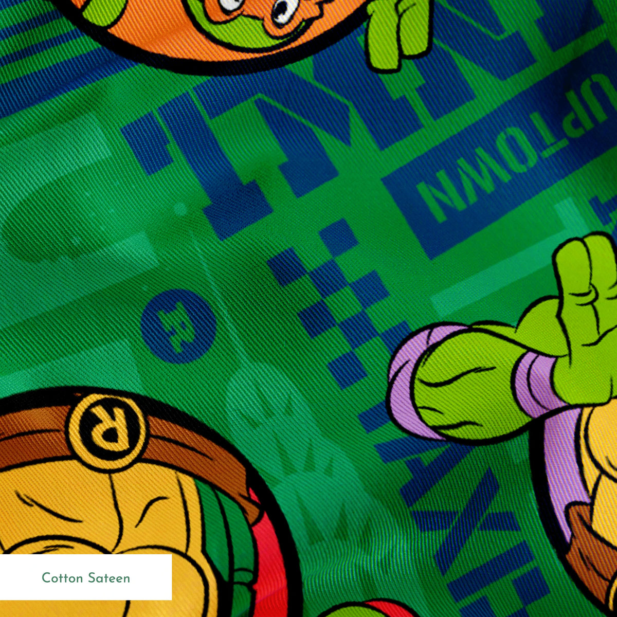 Teenage Mutant Ninja Turtles cartoon characters on green patterned background springs sateen texture