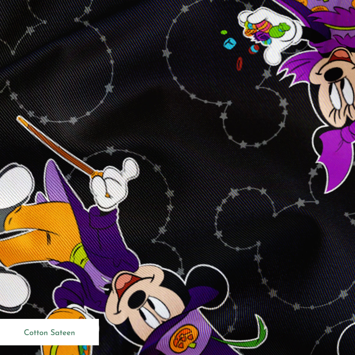 Mickey and Minnie in Halloween costumes on black background with purple, orange, and white details in a scattered pattern springs sateen texture
