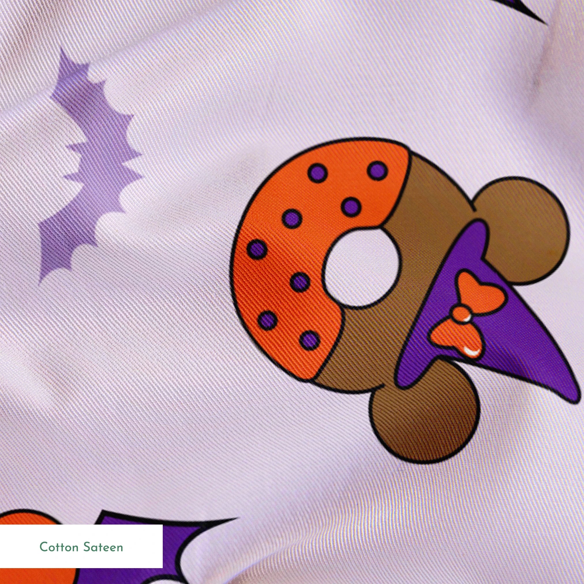 Disney Halloween-themed pattern with orange and black donuts, purple bat wings, and light purple bats on lavender background springs sateen texture