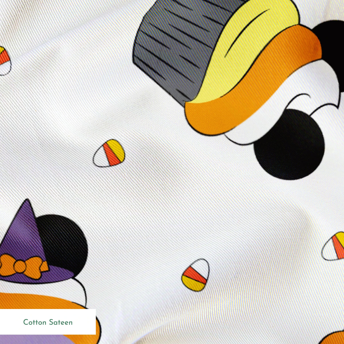 Disney cupcakes with black circular elements and colorful frosting in orange, yellow, and purple on a white background. springs sateen texture
