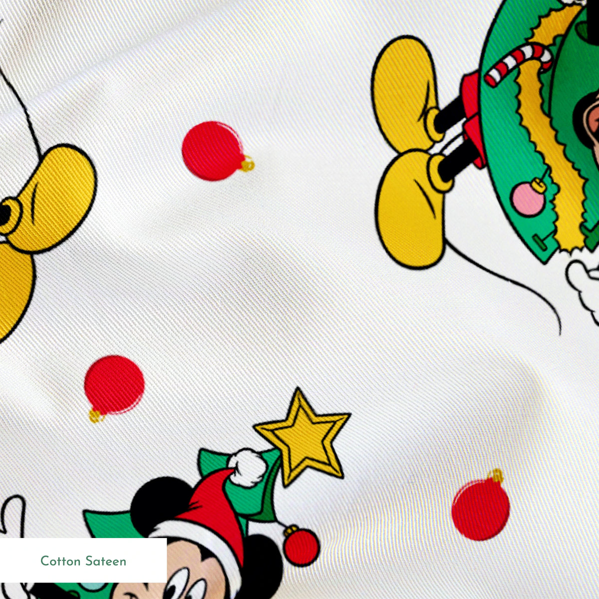 Mickey Mouse in a Christmas tree costume and stars on white background with red dots springs sateen texture
