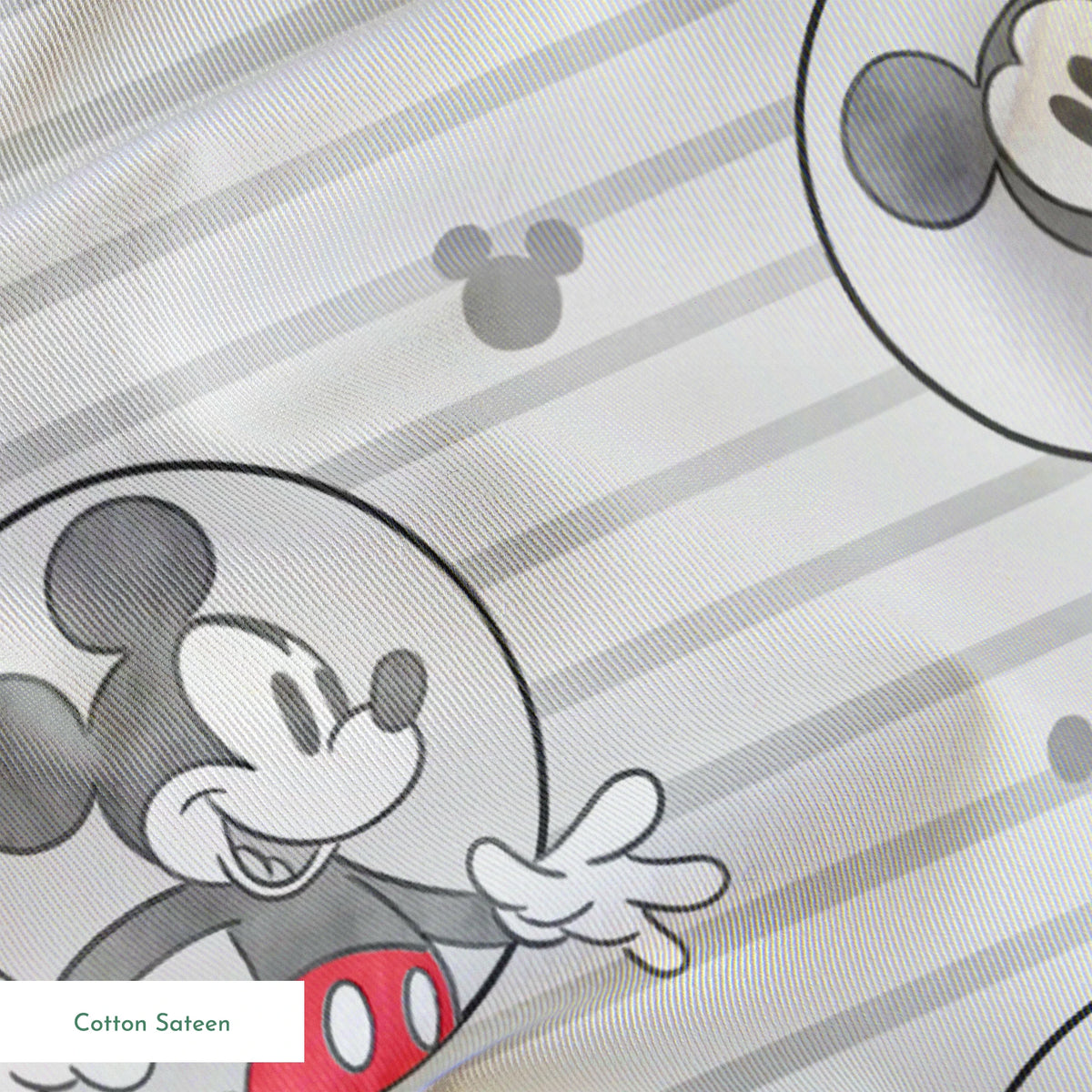 Mickey Mouse pattern on gray striped background with circular character portraits in red, black, and white springs sateen texture