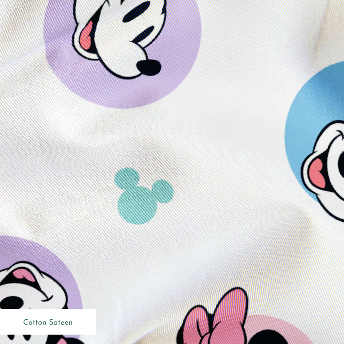 Disney Mickey and Minnie Mouse pattern with character heads on pastel circles, pink bows, and small Mickey icons springs sateen texture