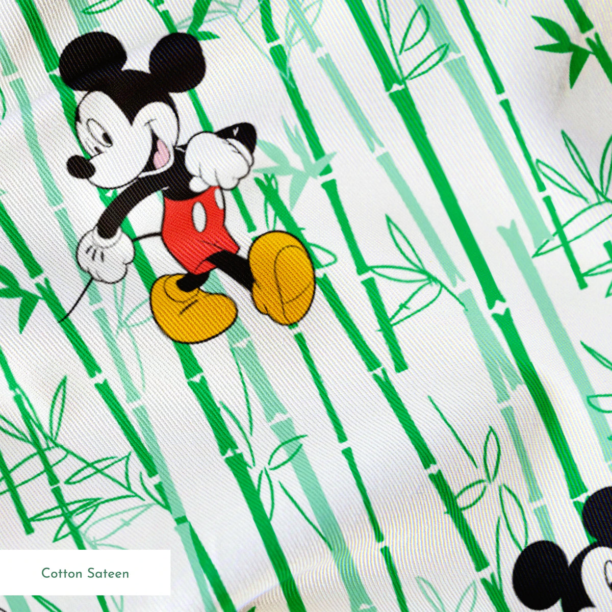 Cartoon mouse character pattern on white background with green vertical stripes springs sateen texture