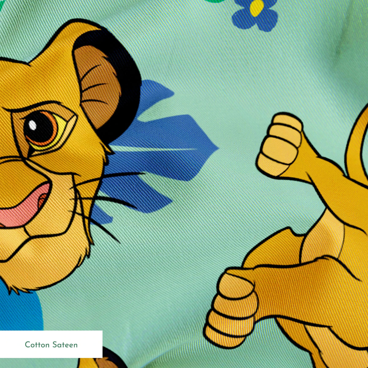Cartoon lion cubs playing on mint green background with blue flowers and green leaves pattern springs sateen texture