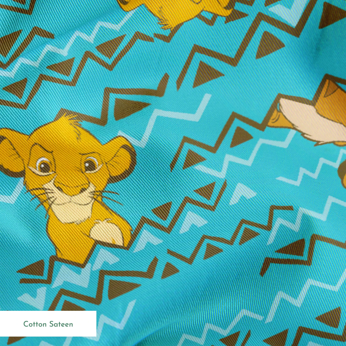 Lion King themed pattern with Simba and Timon characters on turquoise blue background with zigzag stripes springs sateen texture