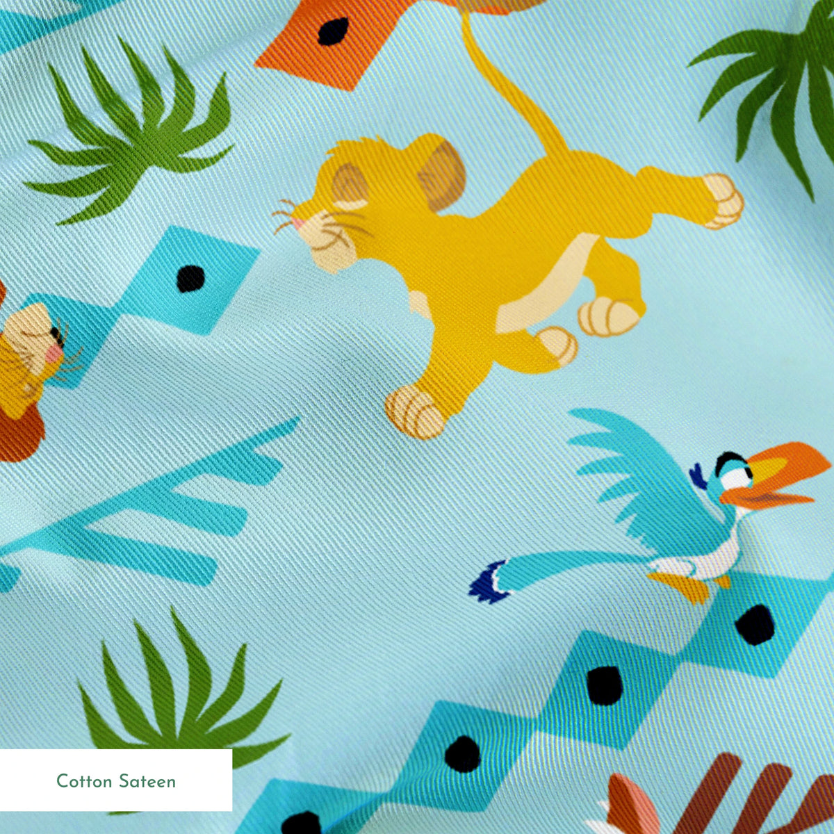 Colorful pattern with cartoon lions, palm trees, and sun designs on a light blue background springs sateen texture