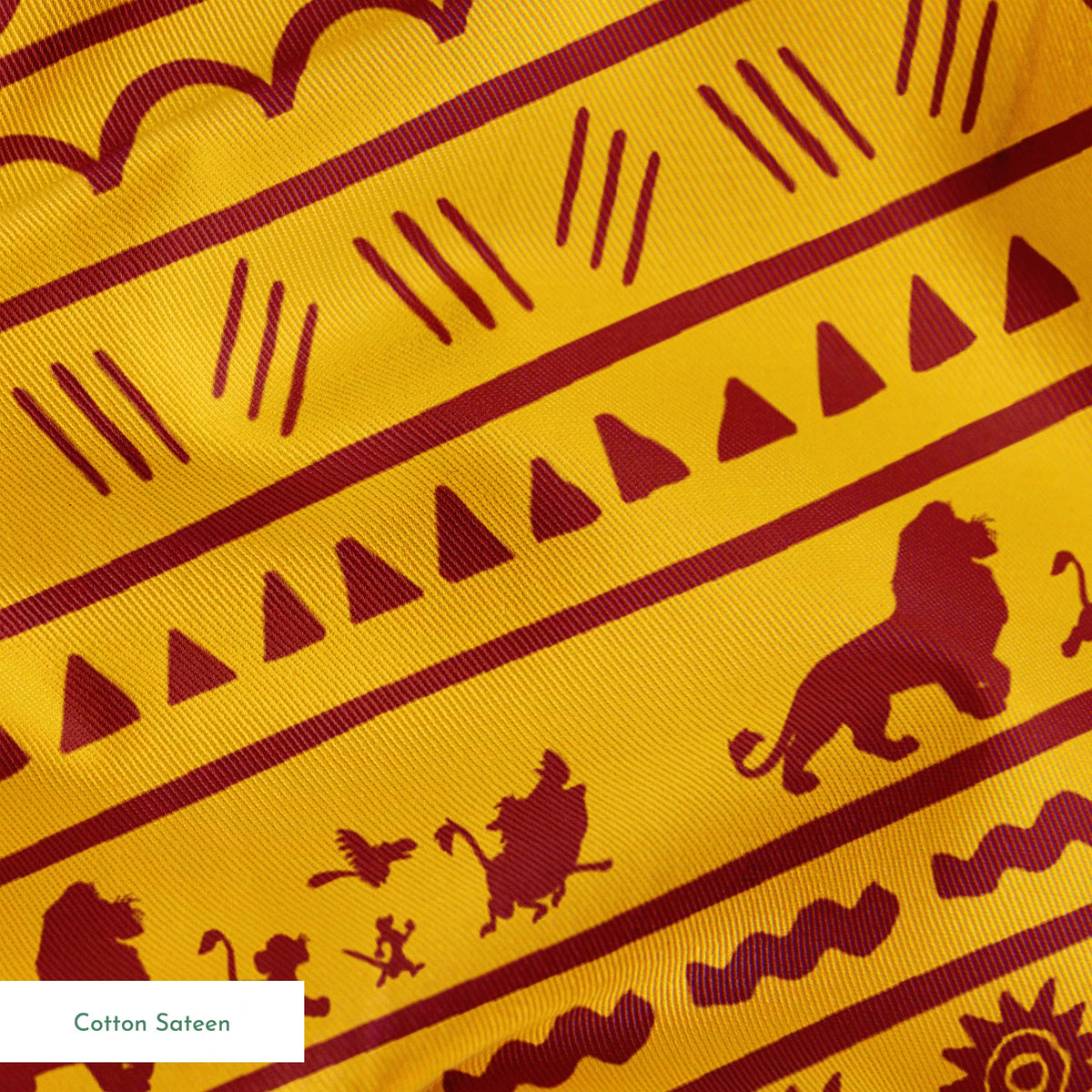 Traditional African pattern in yellow and maroon with spirals, lions, geometric designs, and sun symbols arranged in horizontal bands springs sateen texture