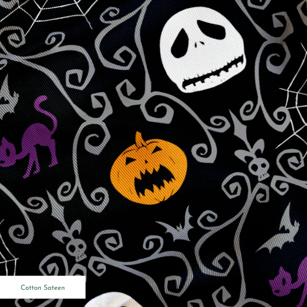 Nightmare Before Christmas pattern with skulls, pumpkins, bats and ornate swirls on black background springs sateen texture
