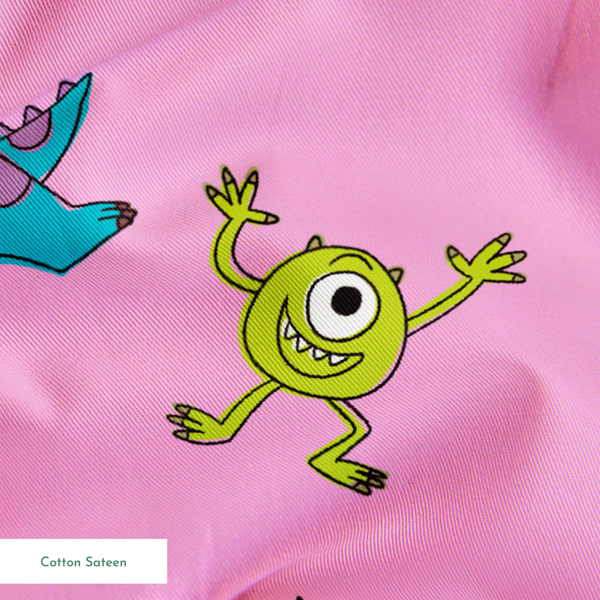 Cartoon monster pattern with blue creatures, green one-eyed characters, and "Arghh!!" text on pink background springs sateen texture