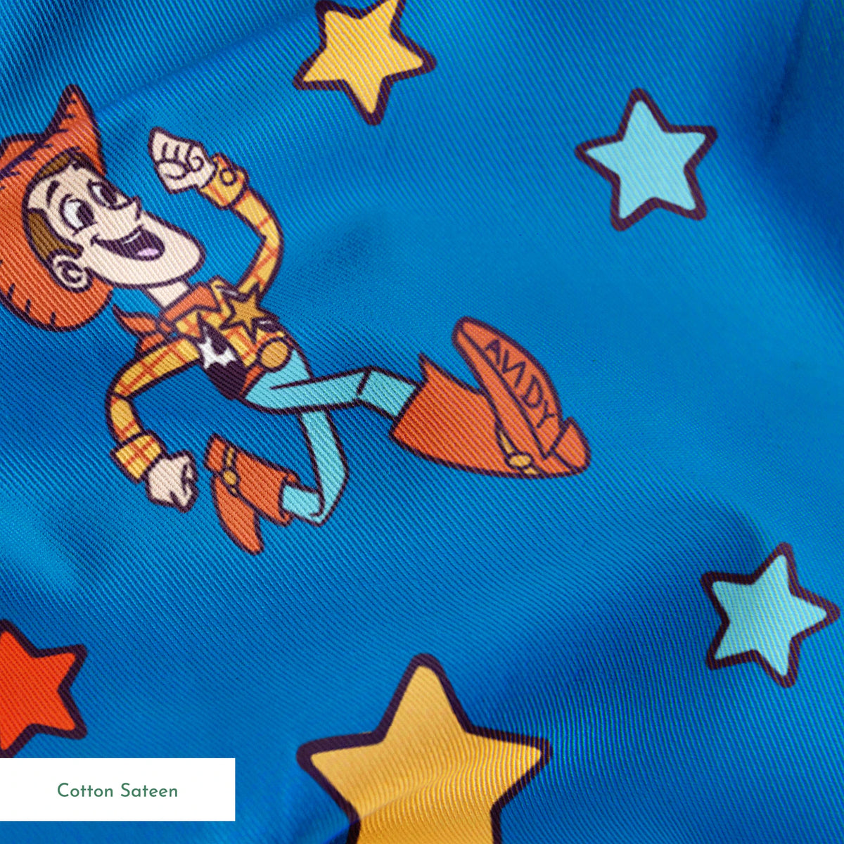 Toy Story characters floating in space pattern with stars on blue background springs sateen texture