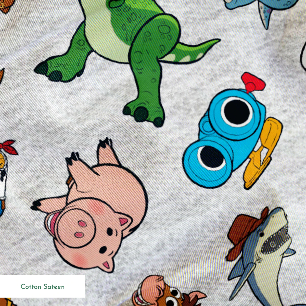 Colorful pattern of various animated Toy Story characters on a light speckled background springs sateen texture