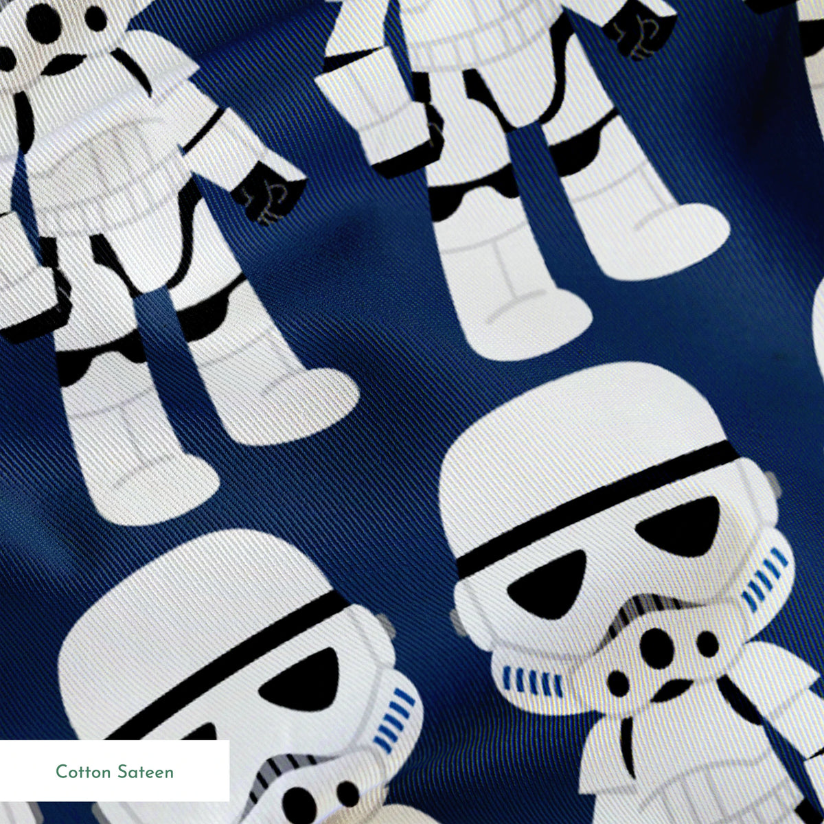 Repeated pattern of cartoon Stormtrooper characters in white armor against dark blue background springs sateen texture