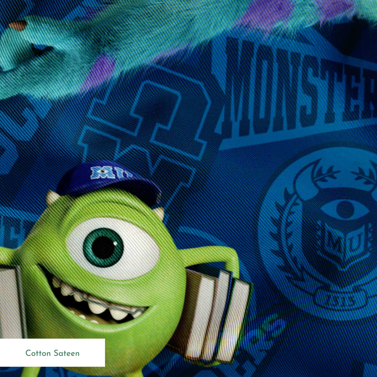 Monsters Inc characters pattern with Mike Wazowski and Sully on blue background springs sateen texture