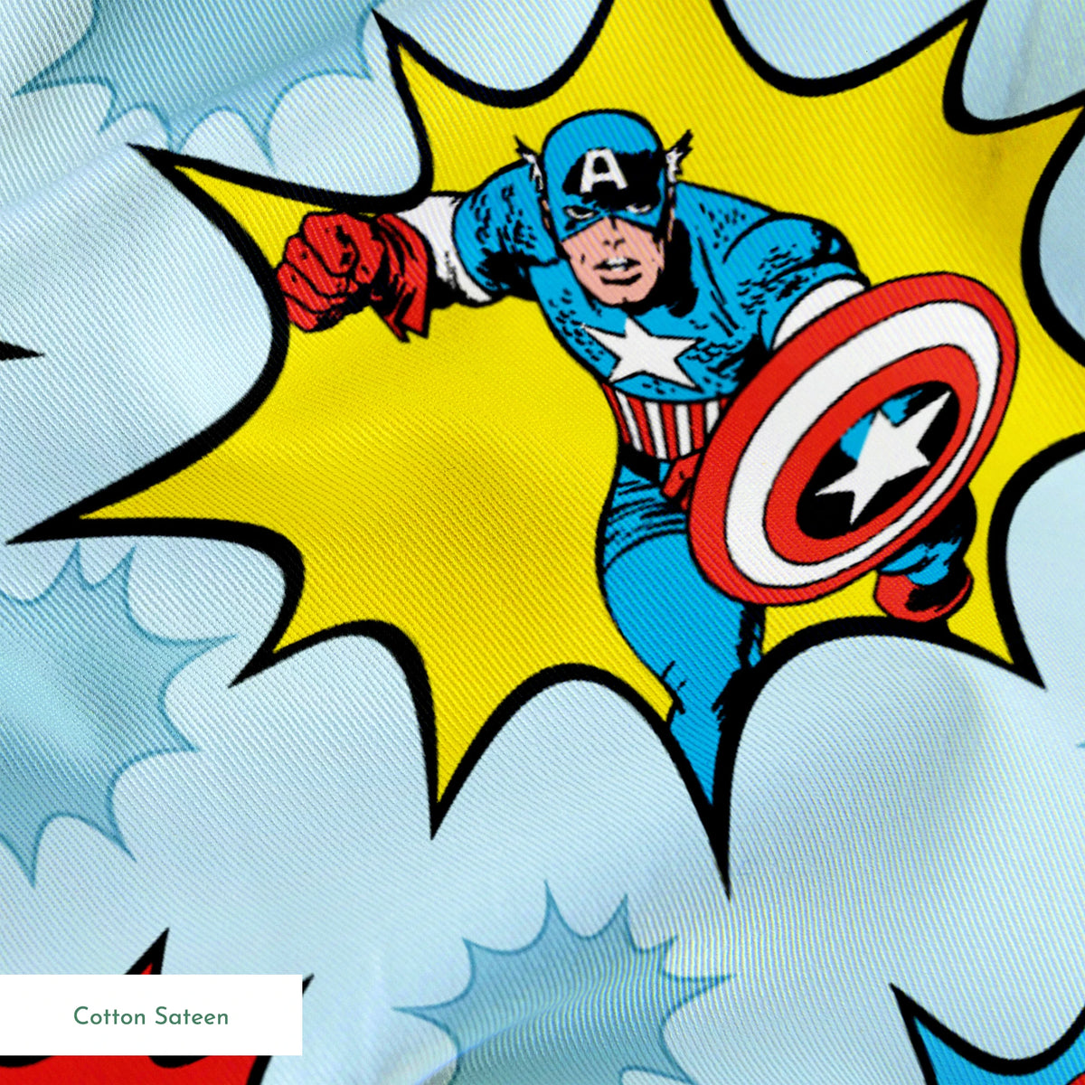 Marvel superhero pattern with Captain America, Iron Man, and Hulk in colorful burst designs on a blue background. springs sateen texture