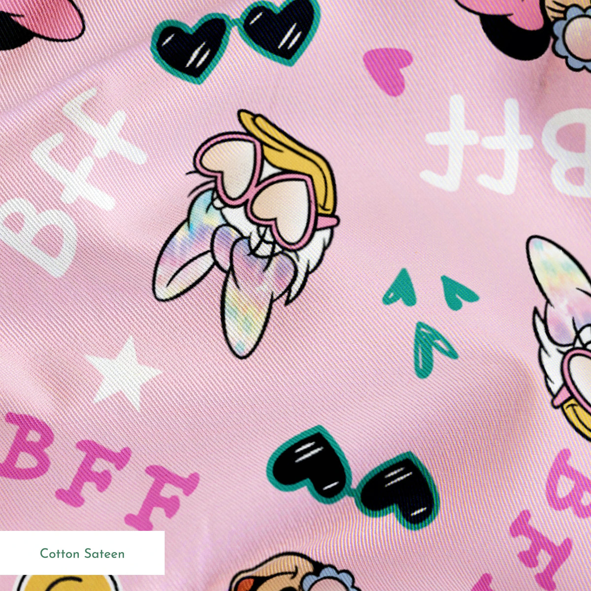 Pink background with Minnie Mouse pattern featuring bows, heart sunglasses, smiley faces, and "BFF" text in playful colors. springs sateen texture