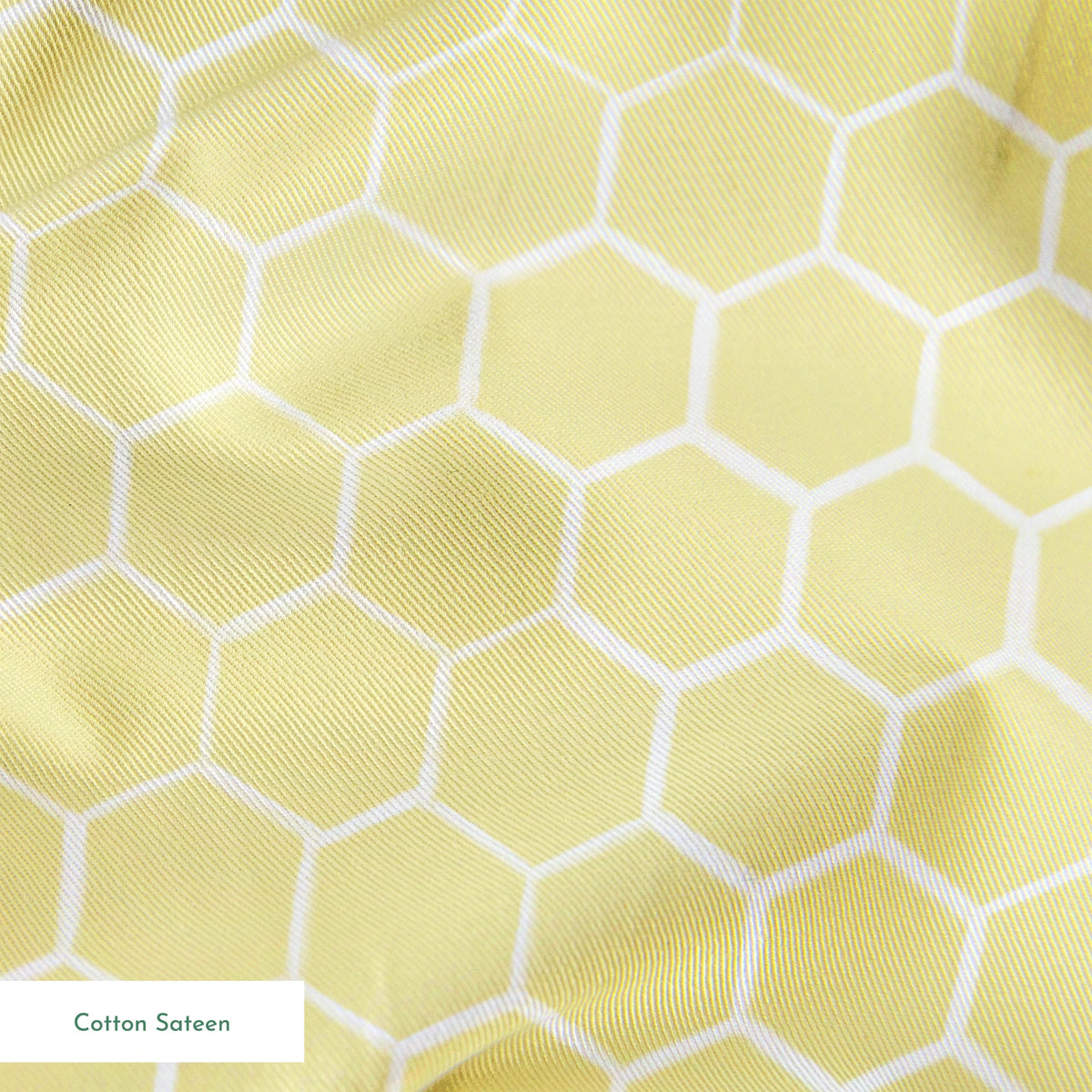 Yellow and white honeycomb pattern fabric designed by Nicole Tamarin with a soft geometric style perfect for bright, cheerful projects. springs sateen texture