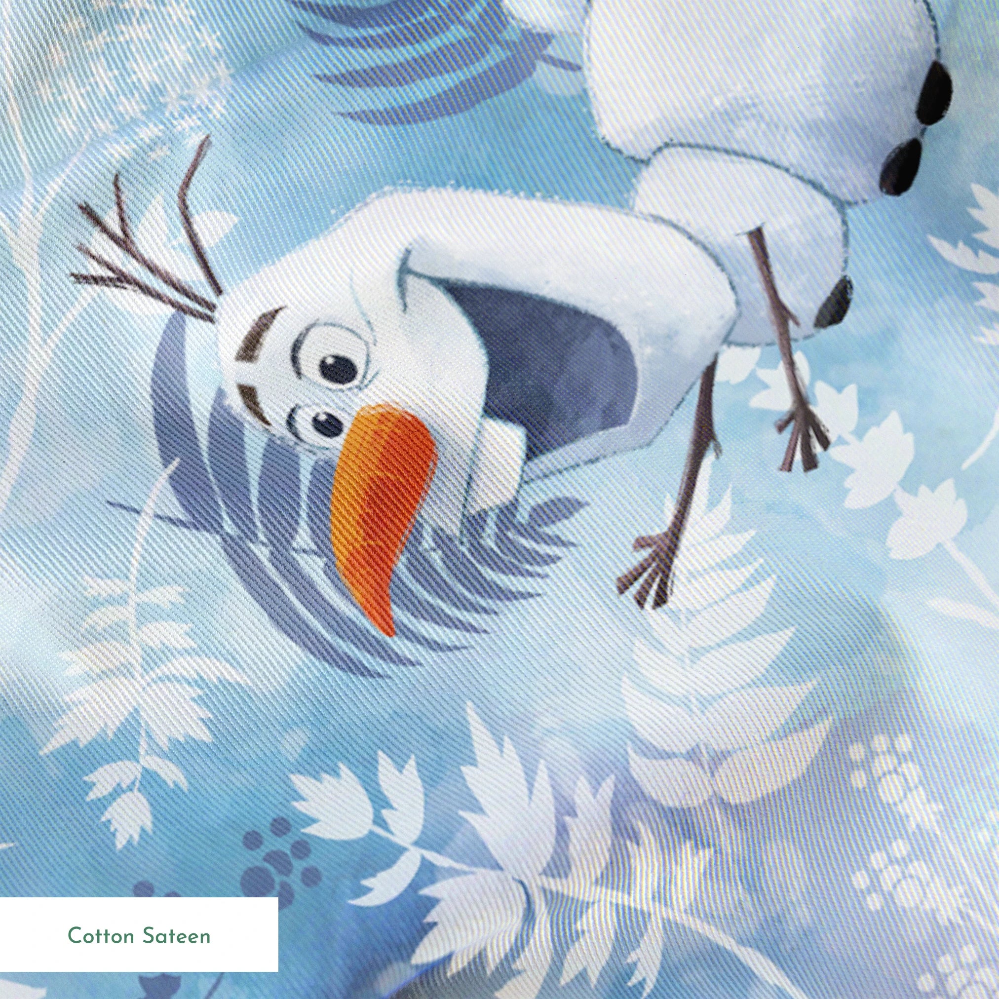 Cheerful Olaf playing among delicate ferns and snowflakes on a light blue background springs sateen texture