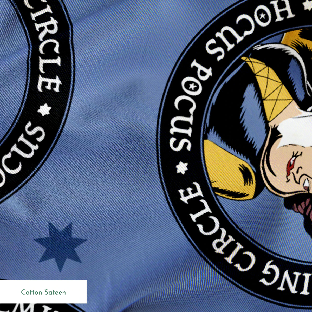Cartoon witches in circular emblems with "Hocus Pocus" text on blue background with stars springs sateen texture