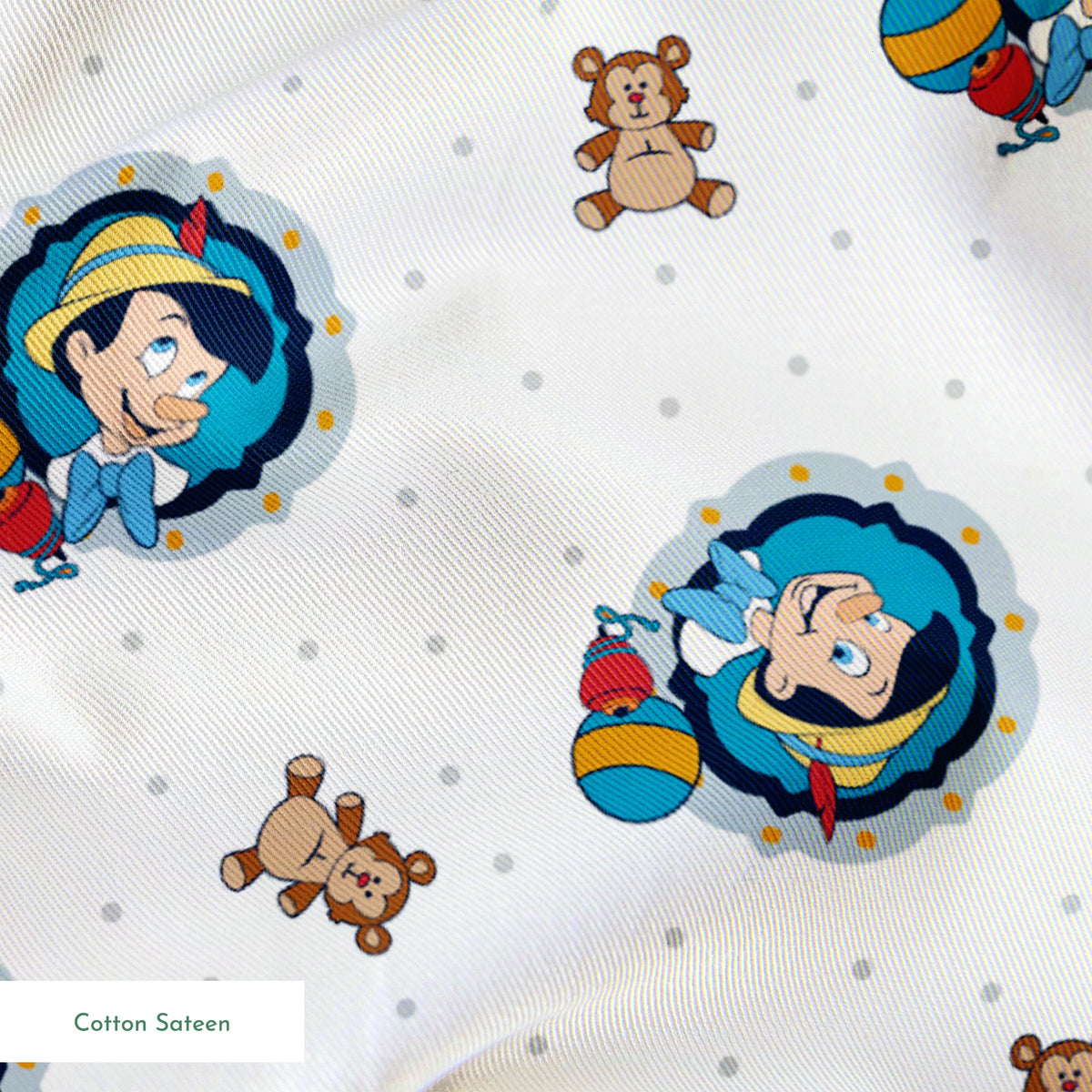 Repeating pattern of cartoon character in blue circle with teddy bears and colorful balls on light dotted background springs sateen texture