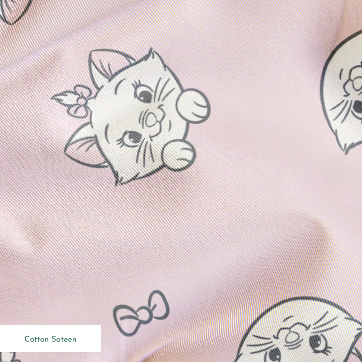Cute cartoon cat faces with bows pattern on light pink background springs sateen texture