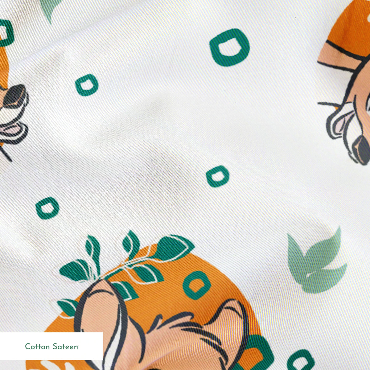 Disney’s Bambi illustrated in golden-orange floral medallions with green leaves and scattered geometric accents on a white background. springs sateen texture