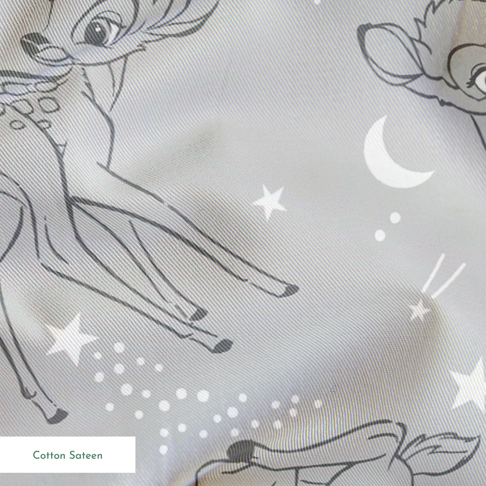 Line art illustrations of Disney’s Bambi surrounded by stars, moons, and stardust trails on a soft gray background in a scattered repeat. springs sateen texture