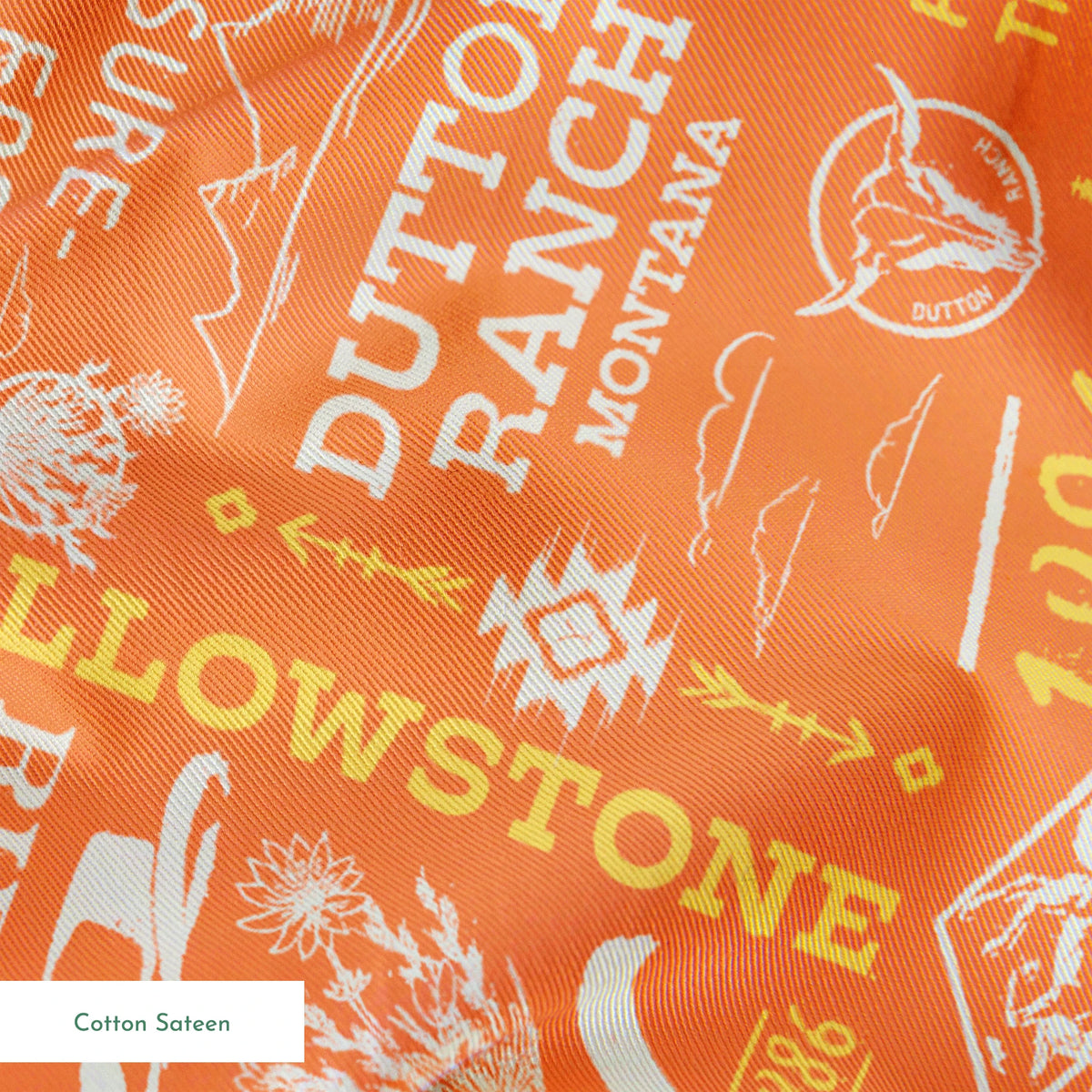 Paramount Yellowstone Verbiage Collage on Orange Fabric