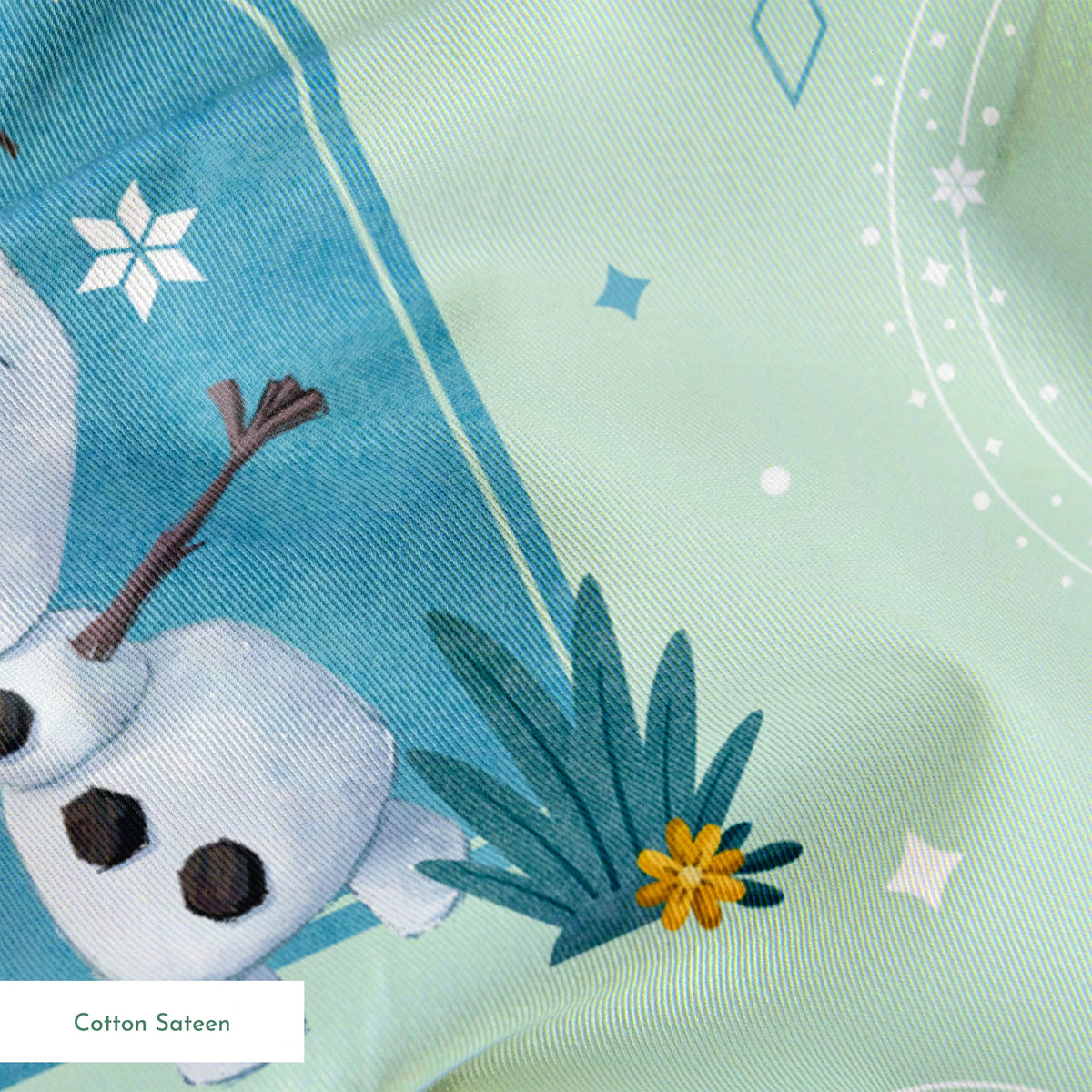 Disney Frozen Falling Snow on Green Fabric