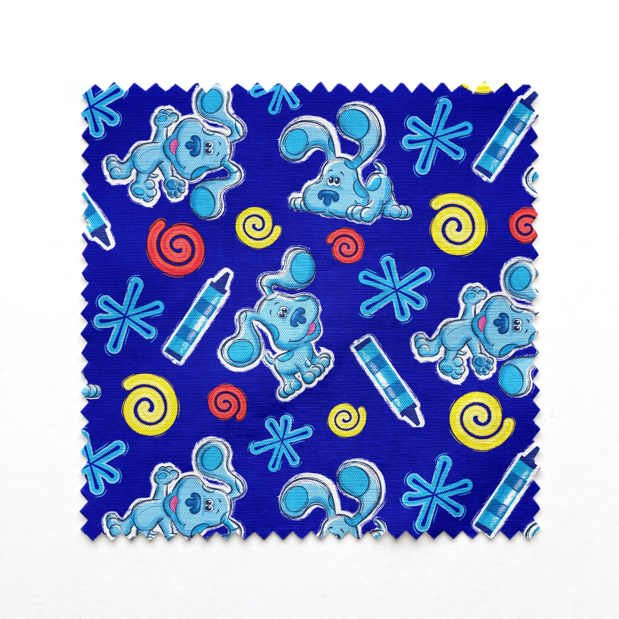 Blue background pattern with cartoon dog characters, snowflakes, spiral shapes, and thermometers in light blue, yellow, and red colors springs swatch pinked