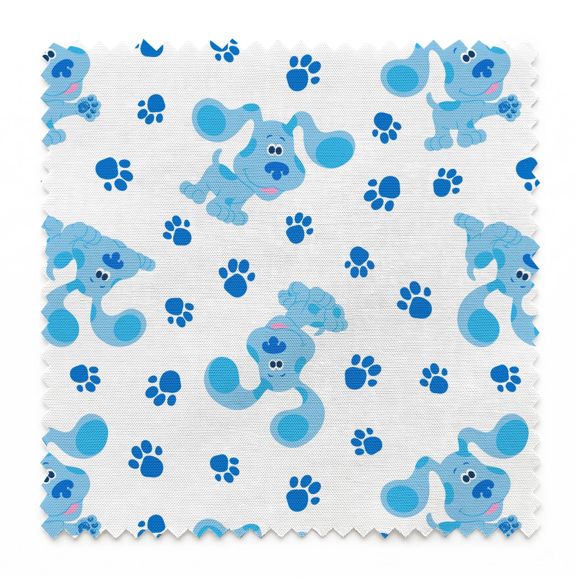 Blue cartoon puppies with floppy ears scattered among paw print pattern on white background springs swatch pinked