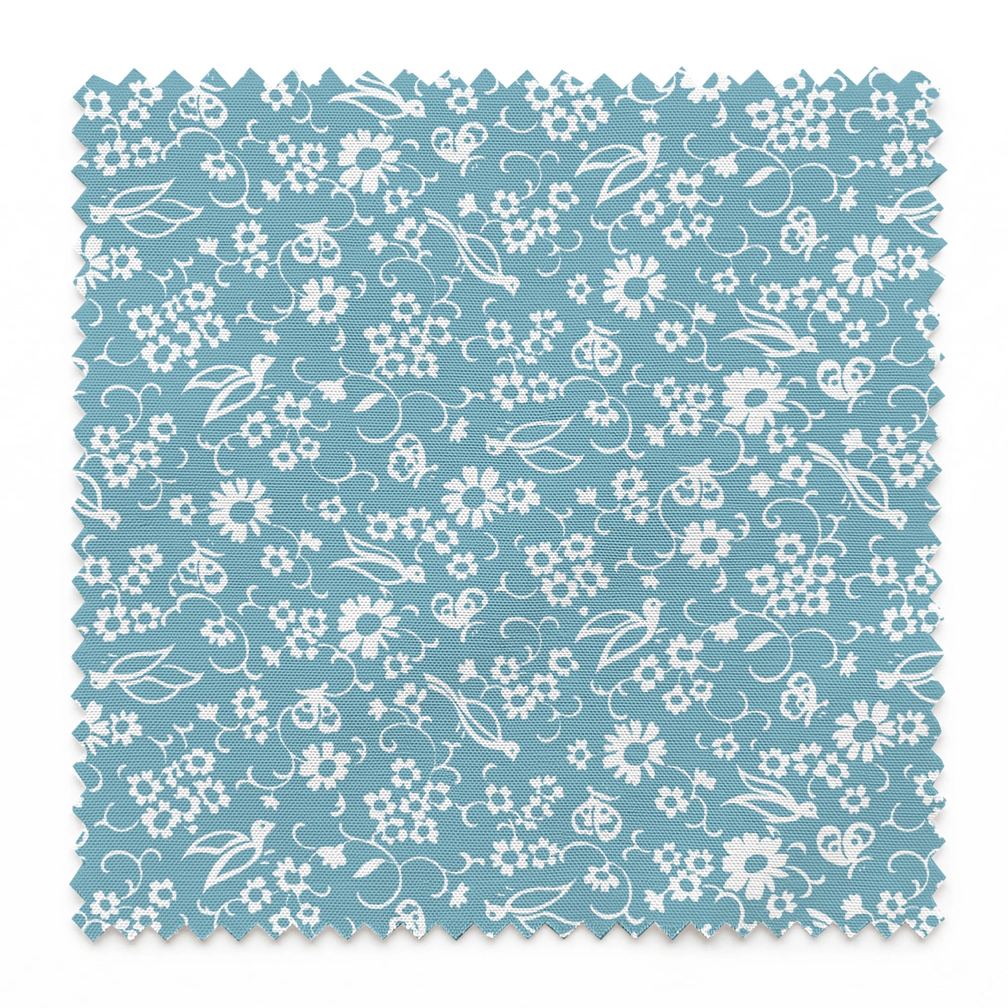 White vintage-style bird and floral silhouettes on a dusty blue background. springs swatch pinked
