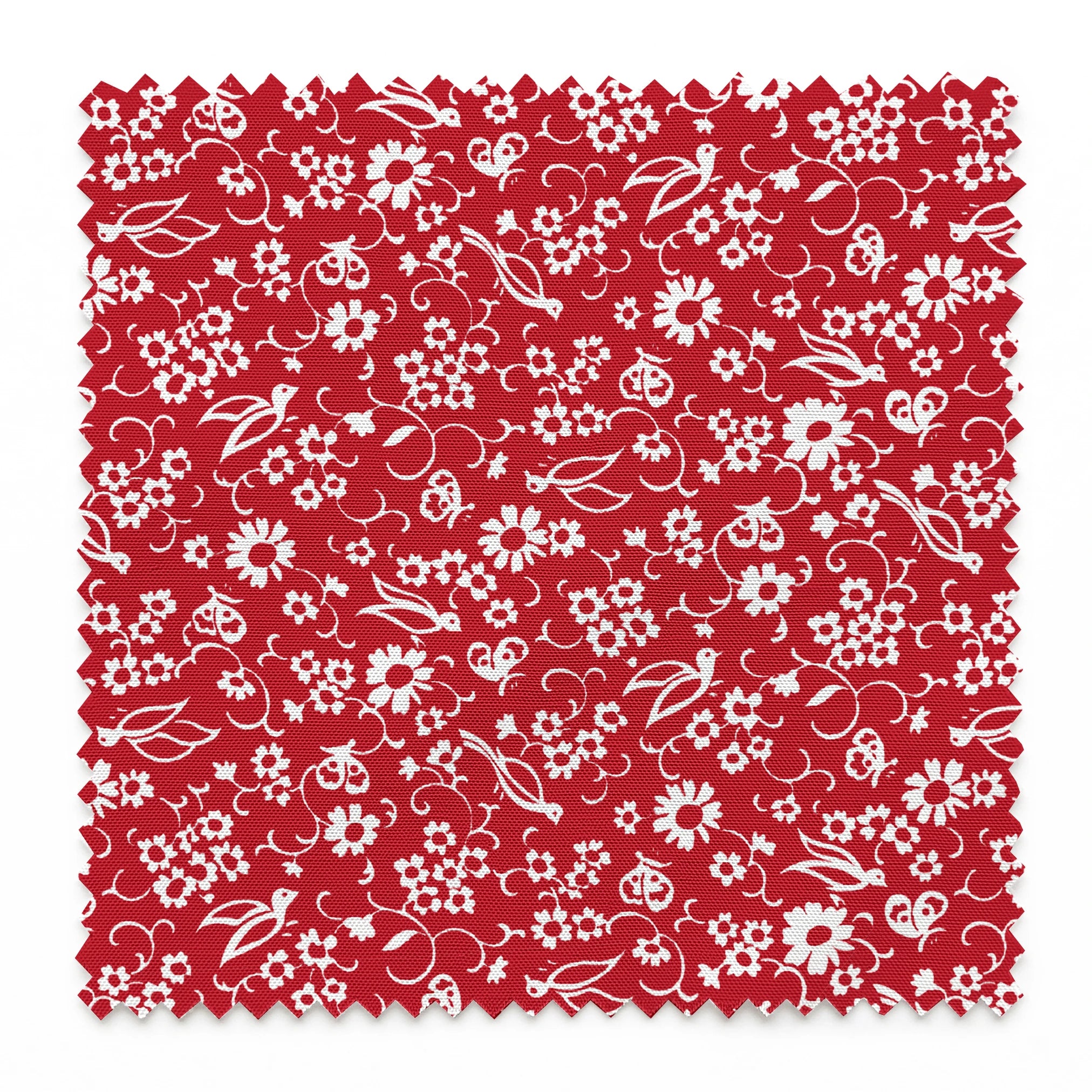 White floral and bird silhouette pattern on a bright red background. springs swatch pinked