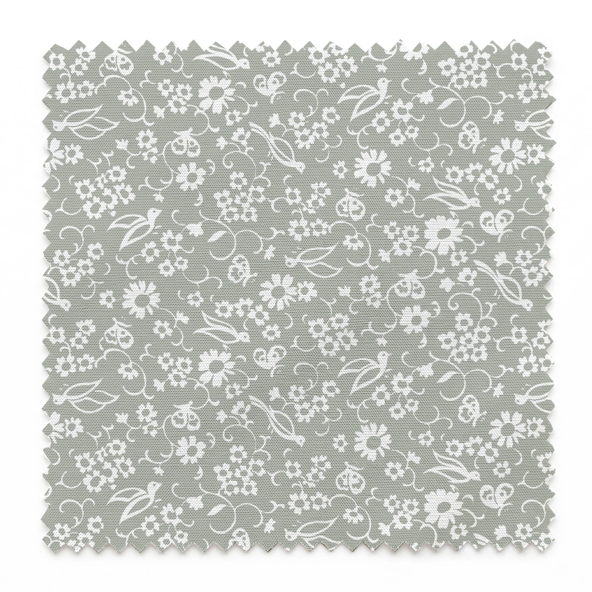 White vintage-style bird and floral silhouettes on a soft gray background. springs swatch pinked