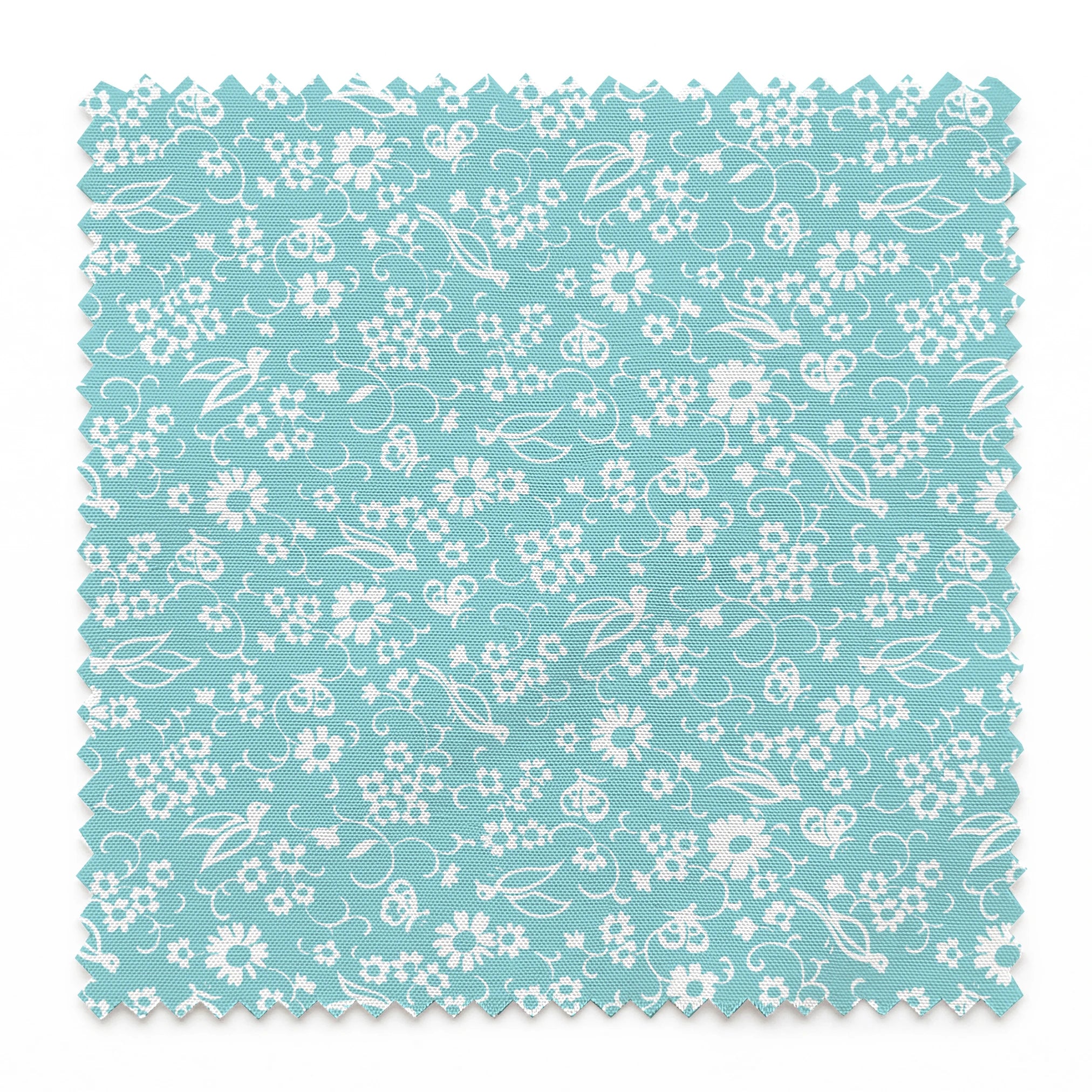 Delicate white floral pattern on a soft turquoise background with swirling leaf motifs springs swatch pinked