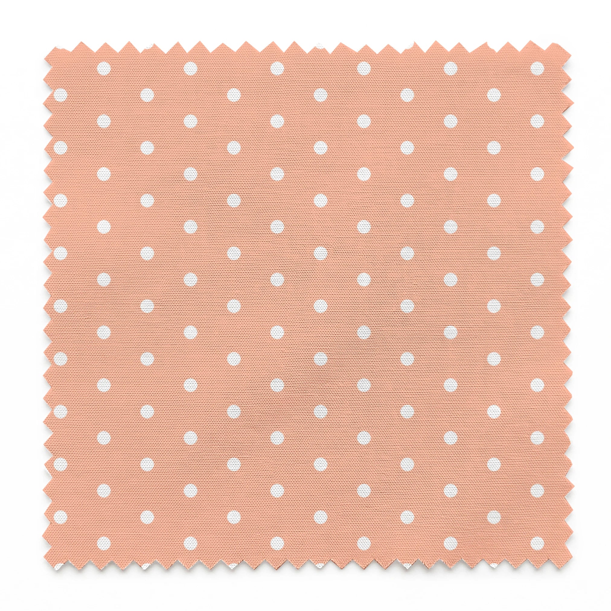 White circles on a peach/salmon colored background springs swatch pinked