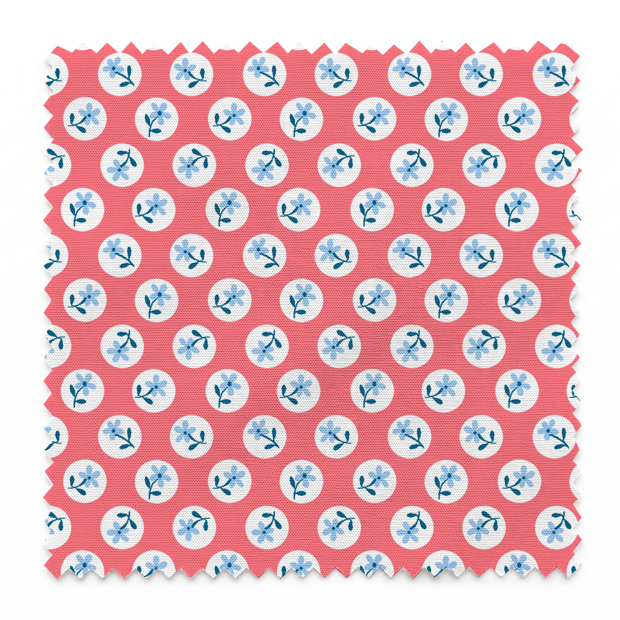 Coral pink background with white circles containing light blue floral designs arranged in a pattern springs swatch pinked