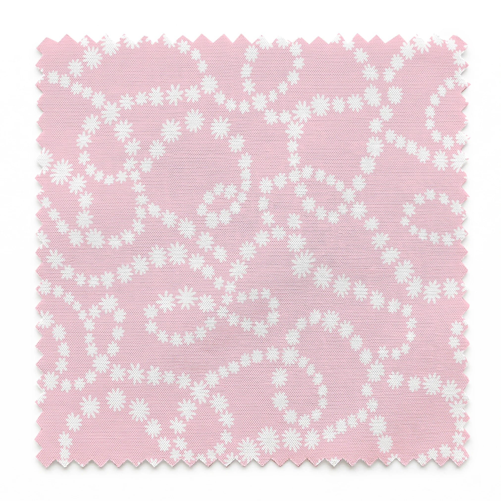 Baby pink background with white dotted swirling pattern creating delicate curved lines and loops springs swatch pinked