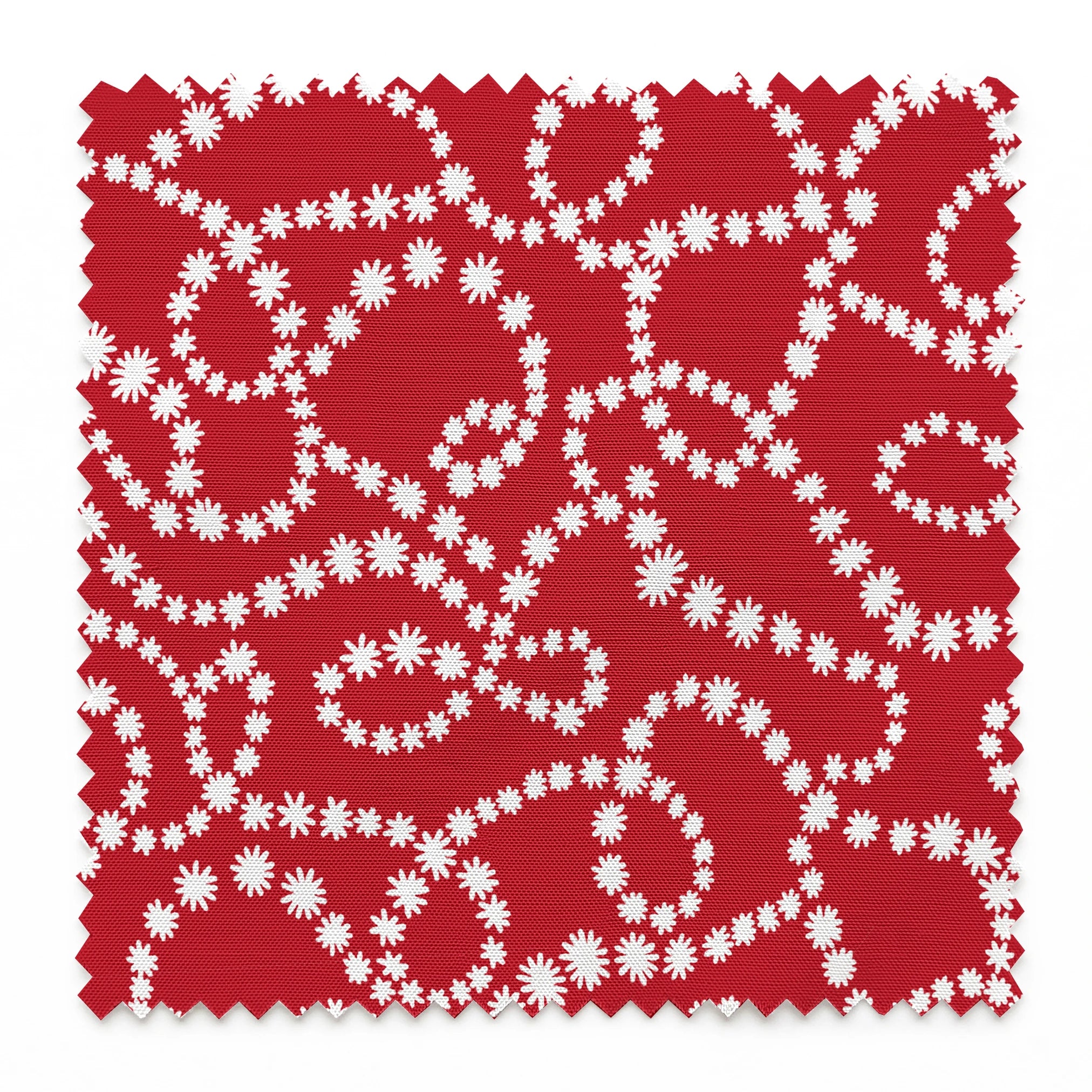 White dotted swirl pattern on rich red background creating decorative curving lines springs swatch pinked