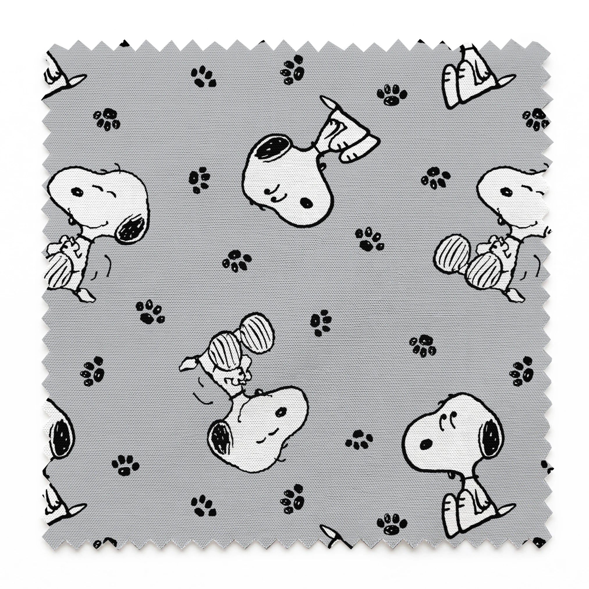 Snoopy with black ears on gray background with paw prints, in various poses springs swatch pinked