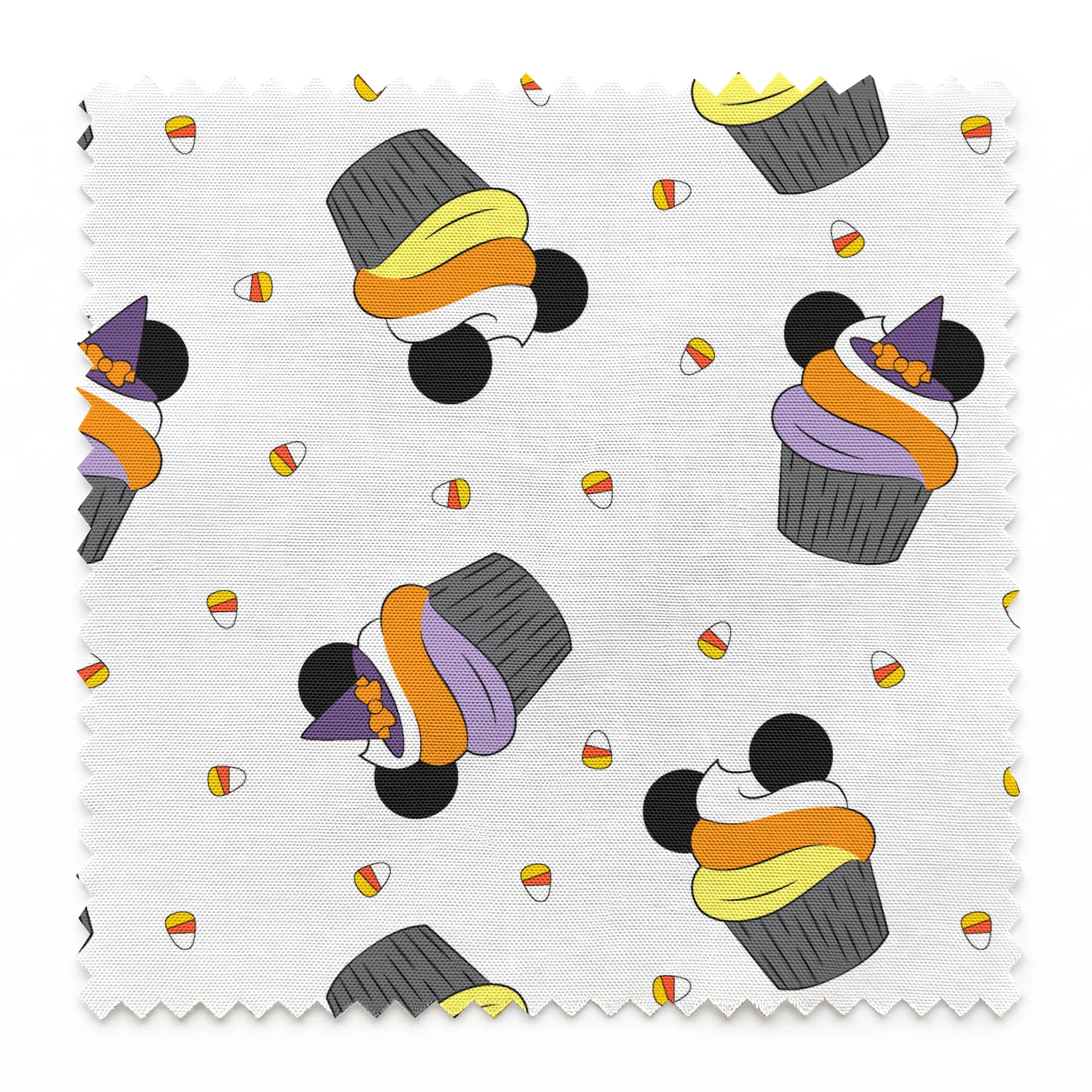 Disney cupcakes with black circular elements and colorful frosting in orange, yellow, and purple on a white background. springs swatch pinked