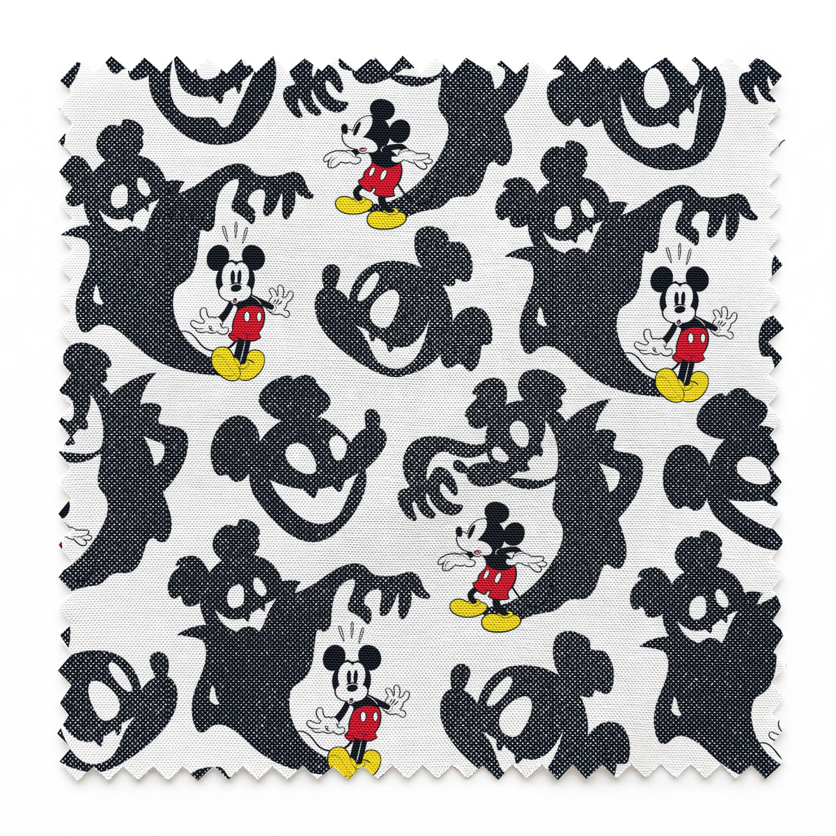 Mickey Mouse pattern with black ghost silhouettes on white background springs swatch pinked